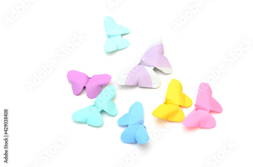 Colorful origami butterflies on white © hachut