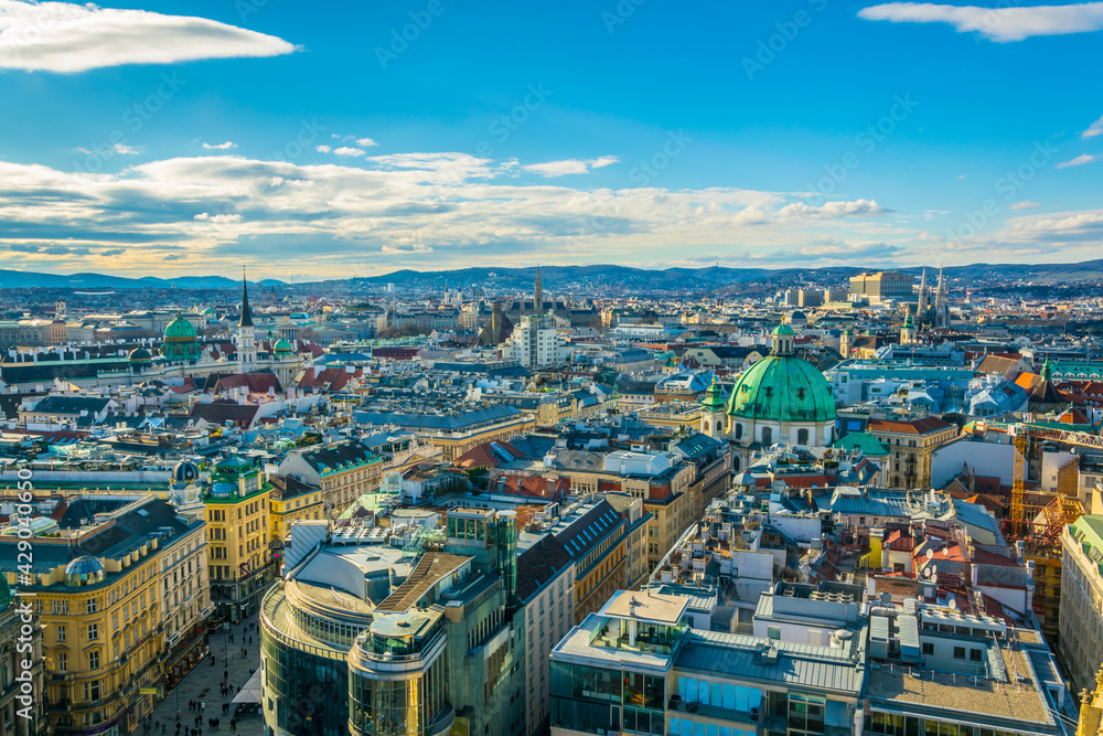 Αυτοκόλλητο Aerial view of Vienna with tower of the town hall building, votivkirche and peterskirche churches from the stephansdom cathedral