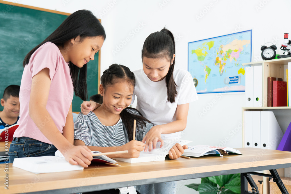 Group Asian students smile and enjoy doing activities with their classmates. Concept of education Group Asian students smile and enjoy doing activities with their classmates. Concept of education