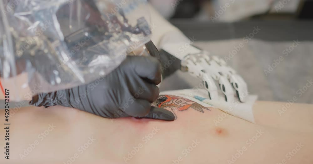The girl with the bionic hand is making tattoo Bionics Cybernetic Robotic-arm Hand prosthesis The girl with the bionic hand is making tattoo Bionics Cybernetic Robotic-arm Hand prosthesis