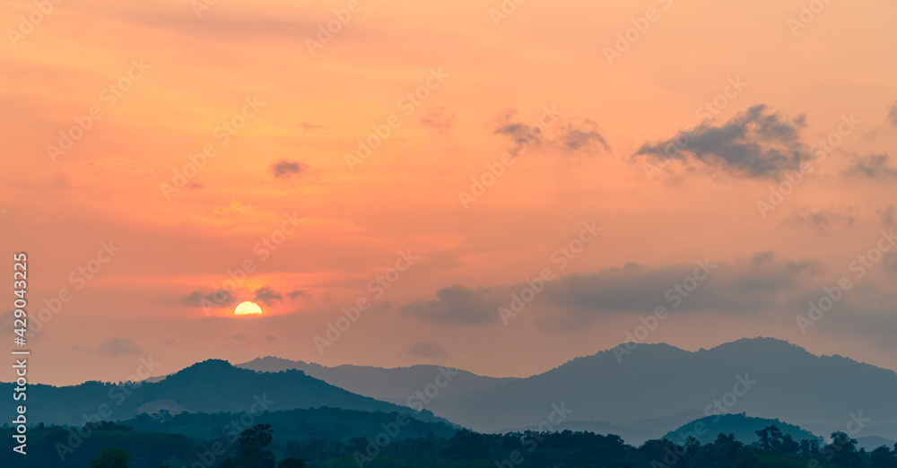 sunset sky over the mountains in the evening