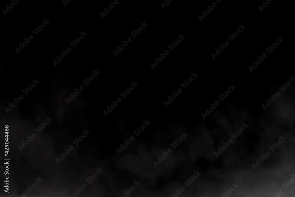 Close-up view of white water vapor with spray from the humidifier. Isolated on black background Close-up view of white water vapor with spray from the humidifier. Isolated on black background