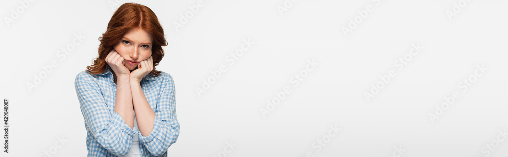 frustrated redhead woman in blue plaid shirt isolated on white, banner. frustrated redhead woman in blue plaid shirt isolated on white, banner.