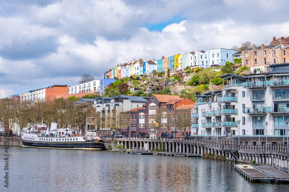 Line of colourful terraced houses on top of a hill in Bristol