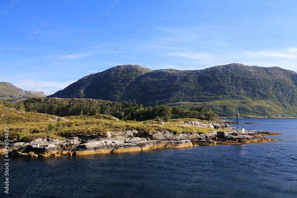 Norway fiord landscape. Fafjorden fiord in Bremanger municipality of Vestland county. Bremangerlandet island in background.