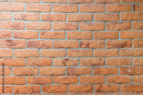 Orange bricks on the wall texture and background