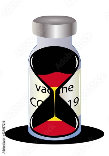 Reloj de arena con la bandera de España en un vial de la vacuna contra la Covid-19. Tiempo límite para la vacunación contra la Covid-19 o coronavirus. 
