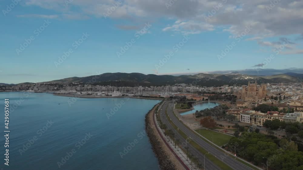 Palma de Mallorca cityscape. Cathedral La Seu of Santa Maria Royal Palace of La Almudaina, old architecture drone top point of view, sunny day. Travel, landmark, famous place. Balearic Islands. Spain Palma de Mallorca cityscape. Cathedral La Seu of Santa Maria Royal Palace of La Almudaina, old architecture drone top point of view, sunny day. Travel, landmark, famous place. Balearic Islands. Spain