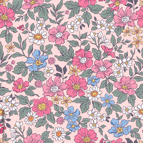 Vintage seamless floral pattern. Liberty style background of small pink and lilac flowers. Small flowers scattered over a pink background. Stock vector for printing on surfaces. Realistic flowers.