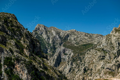 Spectacular valley between majestic rocky mountains. Photograph taken in the Picos de Europa, Asturias, Spain. 