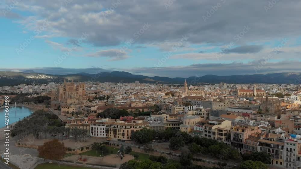 Palma de Mallorca cityscape. Cathedral La Seu of Santa Maria Royal Palace of La Almudaina, old architecture drone top point of view, sunny day. Travel, landmark, famous place. Balearic Islands. Spain Palma de Mallorca cityscape. Cathedral La Seu of Santa Maria Royal Palace of La Almudaina, old architecture drone top point of view, sunny day. Travel, landmark, famous place. Balearic Islands. Spain