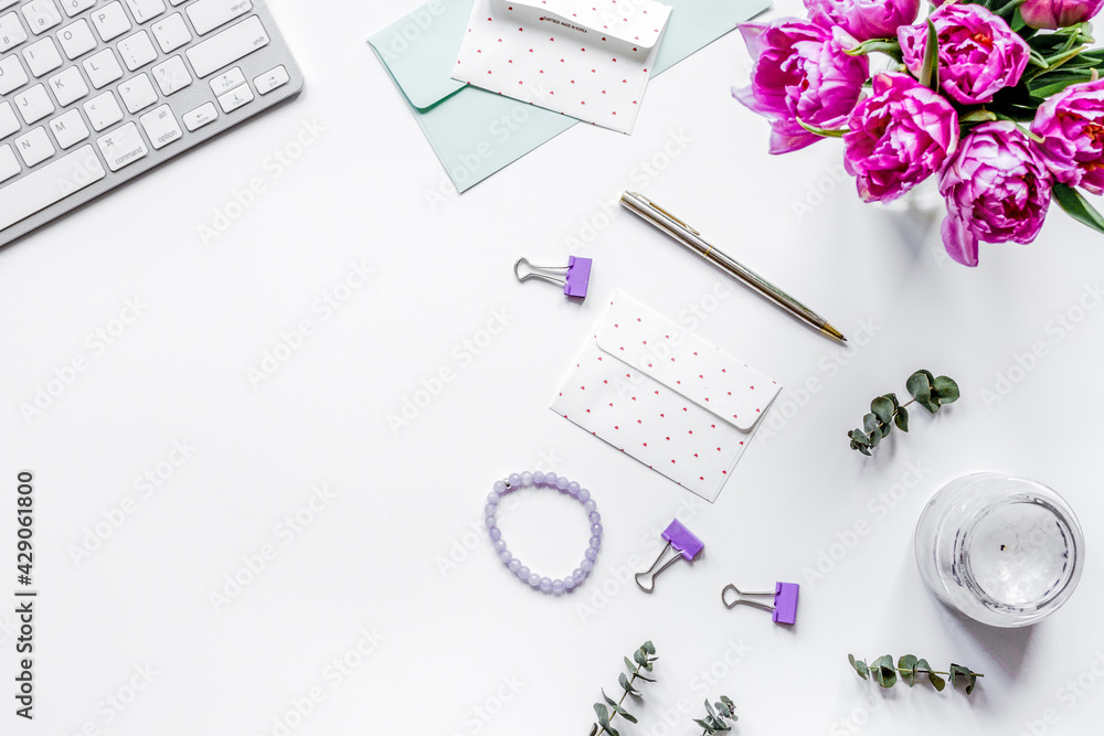 Trendy design of workdesk with blossom on white background top view mock-up Trendy design of workdesk with blossom on white background top view mock-up