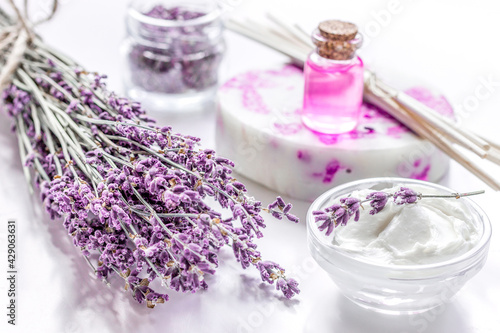 lavender flowers in organic cosmetic set on white background