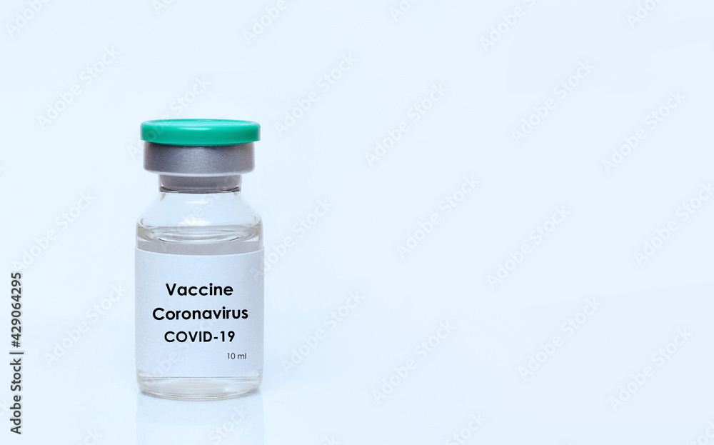 Vial with a vaccine on a white background.The concept of medicine, healthcare and science.Coronavirus vaccine.Copy space for text.. Vial with a vaccine on a white background.The concept of medicine, healthcare and science.Coronavirus vaccine.Copy space for text..