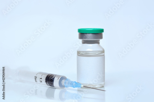 Coronavirus vaccine vial, syringe on white background.The concept of medicine, healthcare and science.Coronavirus vaccine.Copy space for text..