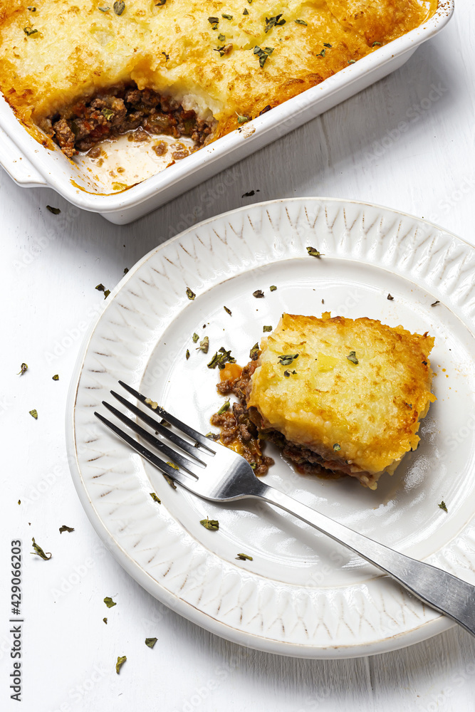 Traditional homemade shepherd pie on white background. Cottage foot