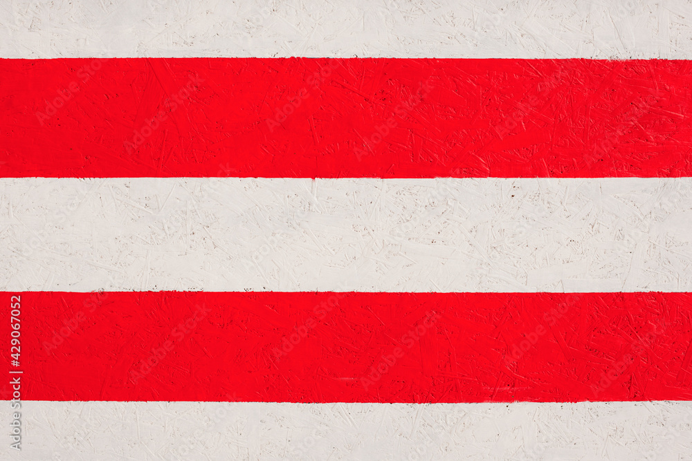 Plywood texture with red and white strips of pait and fragments of compressed sawdust. Plywood background. Wooden texture. Plywood texture with red and white strips of pait and fragments of compressed sawdust. Plywood background. Wooden texture.