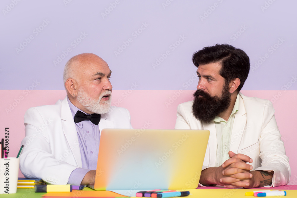Businessmen with laptop working at office workplace. Businessman using pc at work. Businessmen with laptop working at office workplace. Businessman using pc at work.