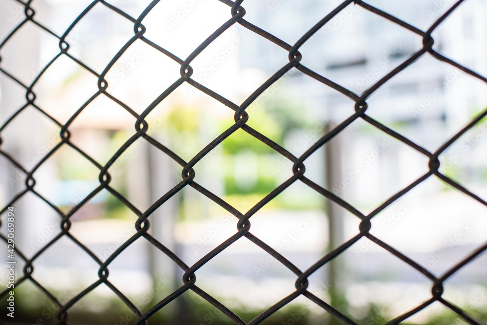 Close-up chain link fence , Sunset background Close-up chain link fence , Sunset background
