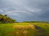 Rainbow in a dark stormy sky over Myakka River State Park in Sarasota Florida USA