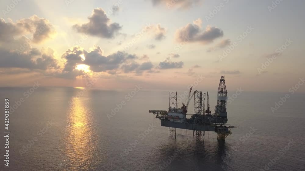 Aerial view of the jack up rig shot during sunset time. Fly around the jack up rig with a drone.
Aerial view of the jack up rig shot during sunset time. Fly around the jack up rig with a drone.
