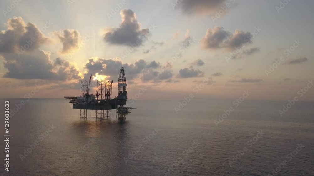 Aerial view of the jack up rig shot during sunset time. Fly around the jack up rig with a drone.
Aerial view of the jack up rig shot during sunset time. Fly around the jack up rig with a drone.