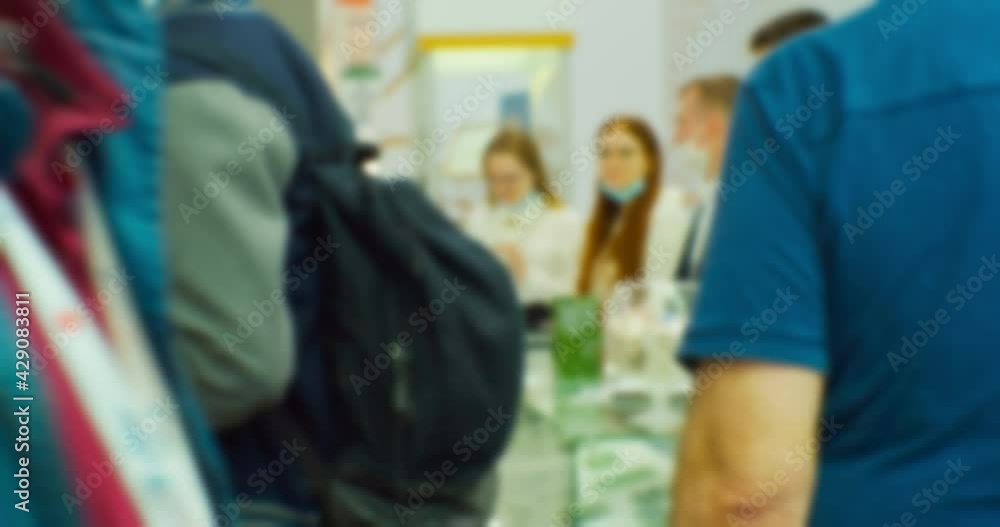 Modern city life. Abstract blurred background on business theme. Blurry defocused video. Unrecognizable people in a large modern building. Modern city life. Abstract blurred background on business theme. Blurry defocused video. Unrecognizable people in a large modern building.