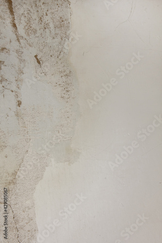 Shabby putty background. Vintage ancient background. Light shade textured old wall