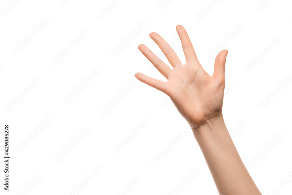 A woman's hand shows five fingers on a white background