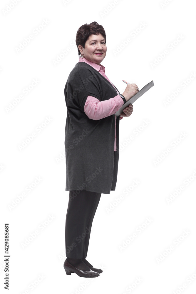 side view. confident mature woman taking notes on clipboard side view. confident mature woman taking notes on clipboard