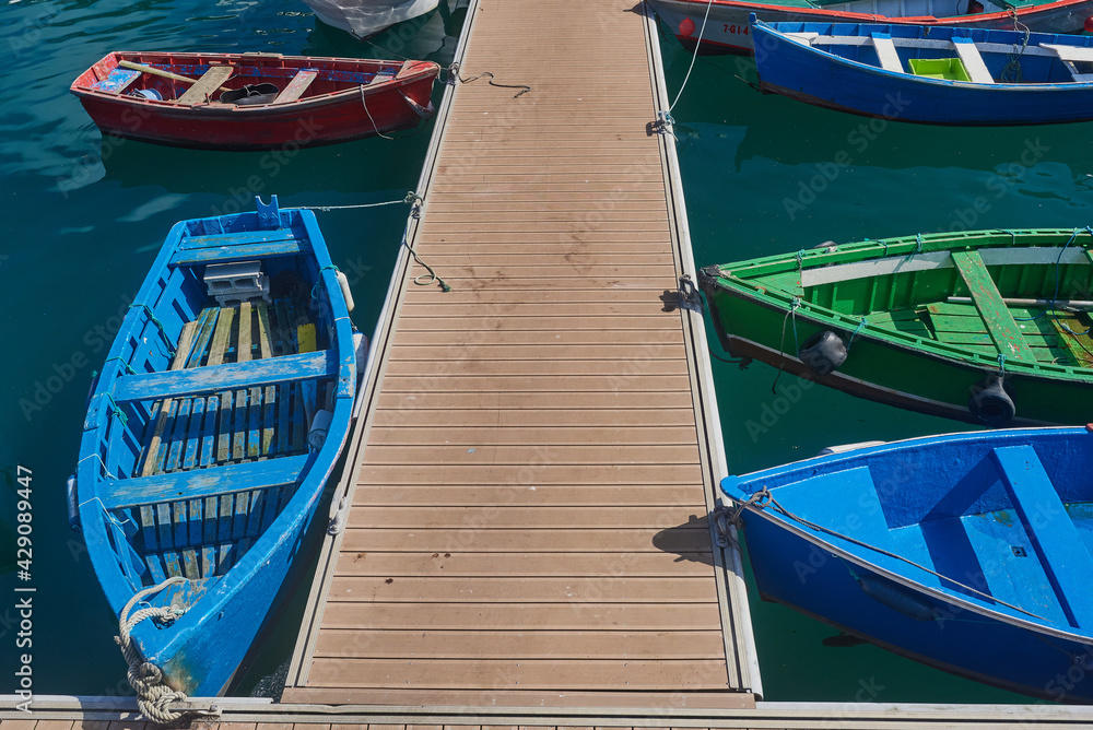 Traditional colored boats in the fishing port of Luarca (Lluarca), in Asturias.
