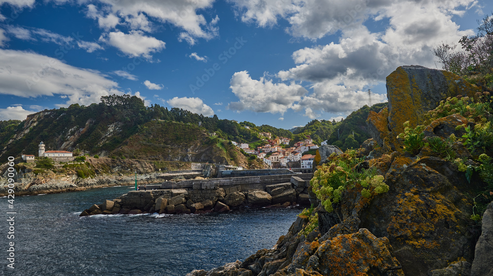 View of the lighthouse and the Asturian town of Cudillero (Cuideiru)