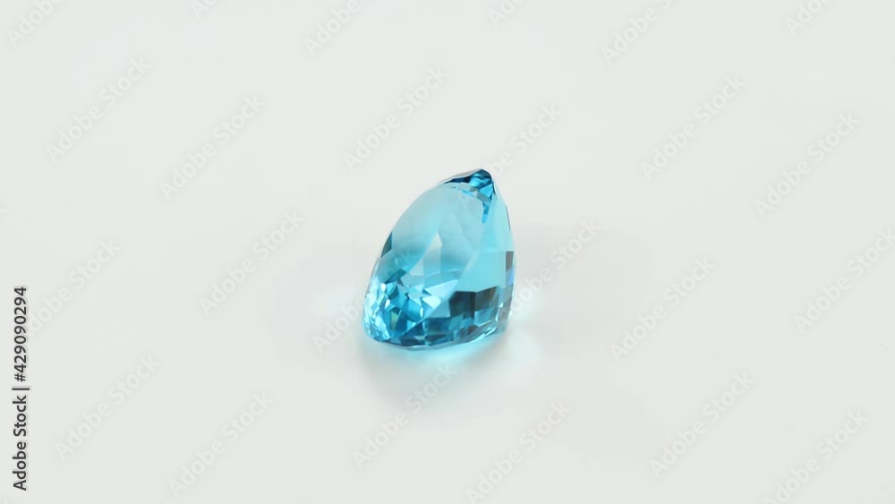 Natural sky blue topaz. Oval cut, checkers faceted, loupe clean - VVS,IF,FL. Heated, treated, irradiated, color enhanced. Full of sparkle semiprecious gemstone in satin polished Aluminum background Natural sky blue topaz. Oval cut, checkers faceted, loupe clean - VVS,IF,FL. Heated, treated, irradiated, color enhanced. Full of sparkle semiprecious gemstone in satin polished Aluminum background