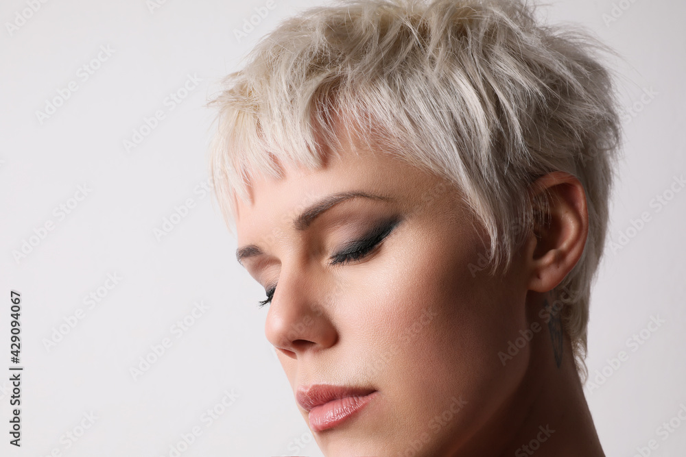 Beauty close-up portrait of fashion young model with short blonde hair. Beauty close-up portrait of fashion young model with short blonde hair.