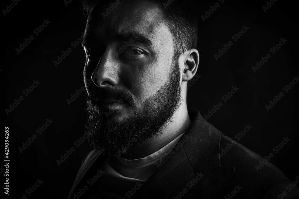 Fototapeta premium Portrait of a brutal young man with a beard. High quality photo
