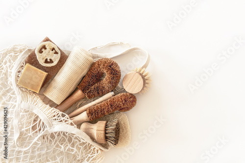 Zero waste kitchen cleaning concept. Eco friendly natural cleaning tools and products, bamboo dish brushes. No plastic, eco-friendly lifestyle. Top view, flat lay.