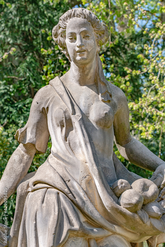 Ancient decayed statue of a sensual Renaissance Era woman in the ...