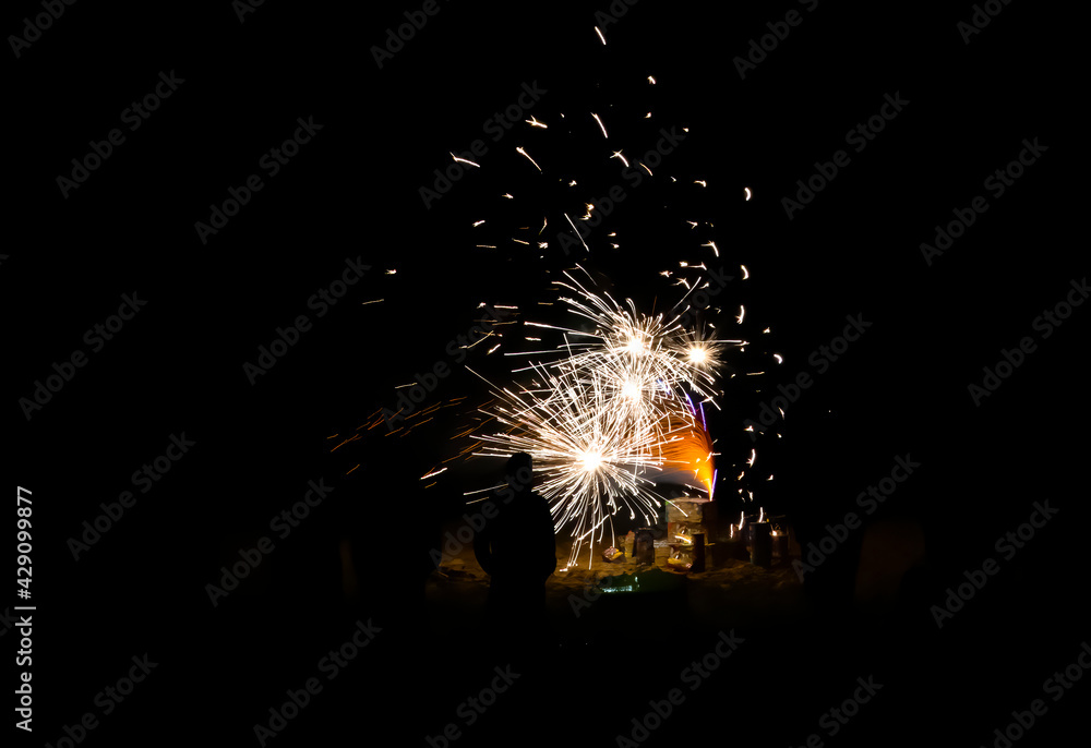 People Watch Beach Fireworks in Silhouette Close Up People Watch Beach Fireworks in Silhouette Close Up