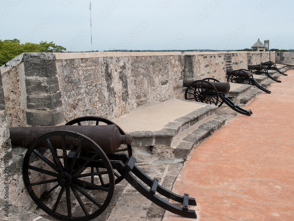 Five Spanish colonial cannon on the ramparts of the historic Fort of San Miguel, Campeche, Mexico.