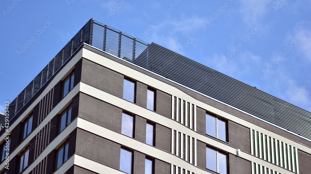 A fragment of modern architecture, walls and glass. Detail of New luxury house and home complex. Part of city real estate property and condo architecture.