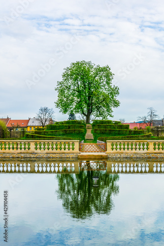 View of an artificial pond inside of the Kvetna zahrada garden in Kromeriz enlisted as the unesco world heritage site. photo