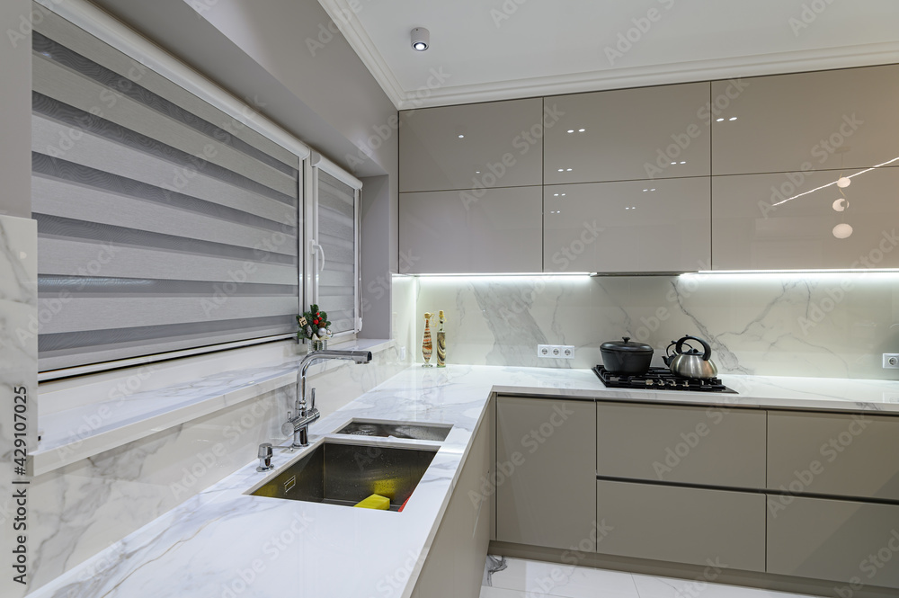 Luxury white modern marble kitchen in studio space - obrazy, fototapety, plakaty 