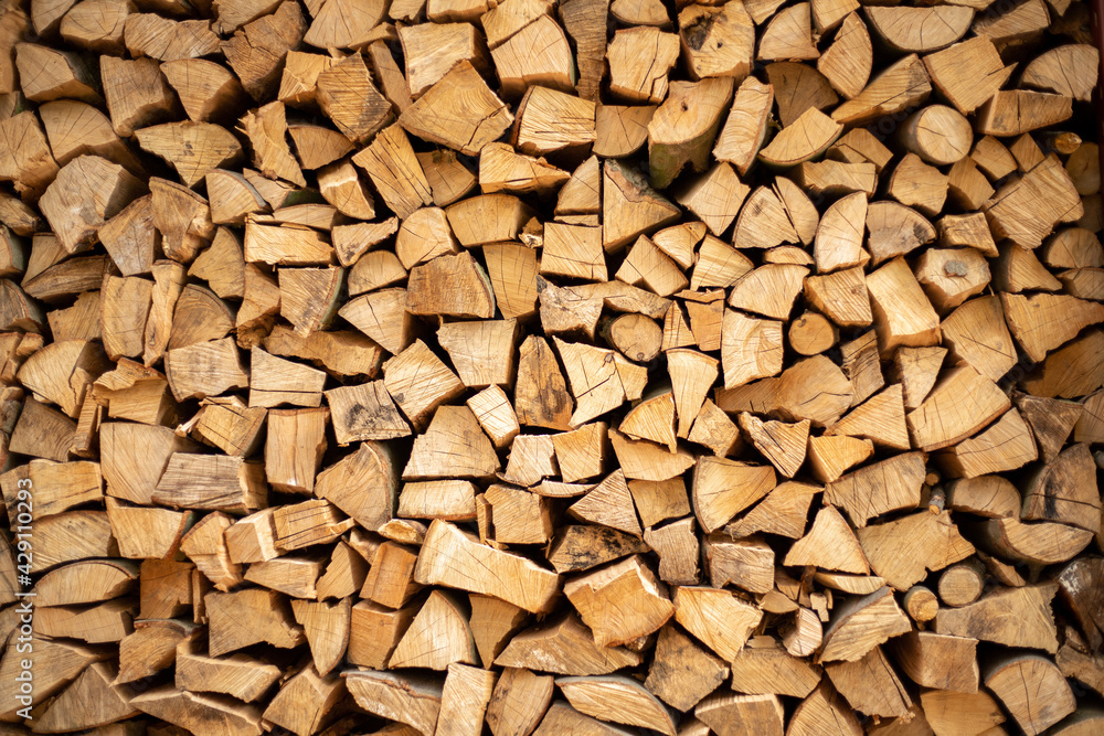 wall firewood , Background of dry chopped firewood logs in a pile. wall firewood , Background of dry chopped firewood logs in a pile.