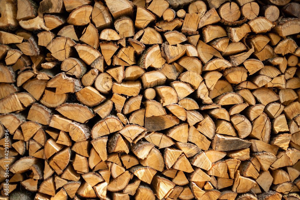 wall firewood , Background of dry chopped firewood logs in a pile. wall firewood , Background of dry chopped firewood logs in a pile.