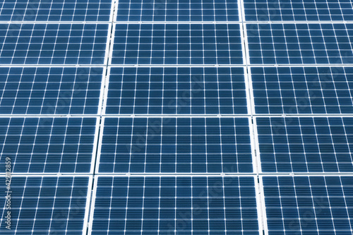 Solar panel texture. Environmental technology. Green eco power supply background. Electrical cell generating current. Renewable sources of energy. Photovoltaic panels pattern.