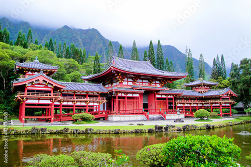 Beautiful shot of the historic Byodo-In Temple near mountains in Ahuimanu, USA photo