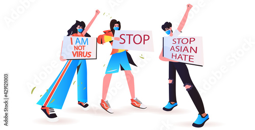 stop asian hate activists in masks holding banners against racism support people during coronavirus pandemic