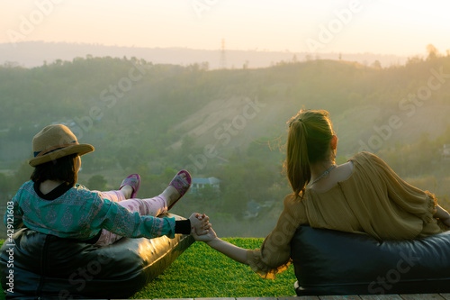 mother and daughter in the sunset