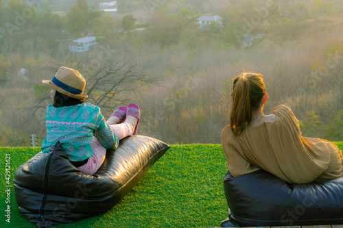 Mother and daughter in the valley at sunset