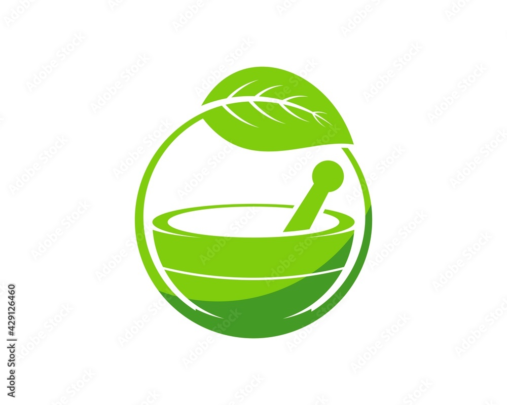 Mortar and pestle inside green circle leaf Mortar and pestle inside green circle leaf